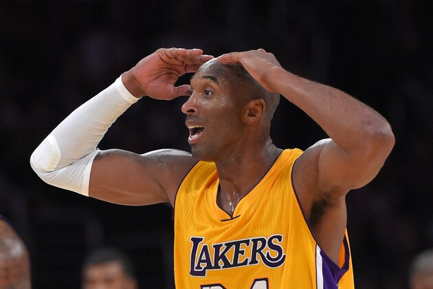Los Angeles Lakers guard Kobe Bryant reacts after he was called for traveling during the second half of an NBA basketball game Phoenix Suns, Tuesday, Nov. 4, 2014, in Los Angeles. The Suns won 112-106. (AP Photo/Mark J. Terrill)