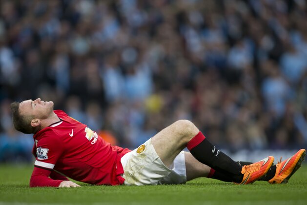 Manchester United's Wayne Rooney reacts after a missed opportunity during his team's English Premier League soccer match against Manchester City at the Etihad Stadium, Manchester, England, Sunday Nov. 2, 2014. (AP Photo/Jon Super)