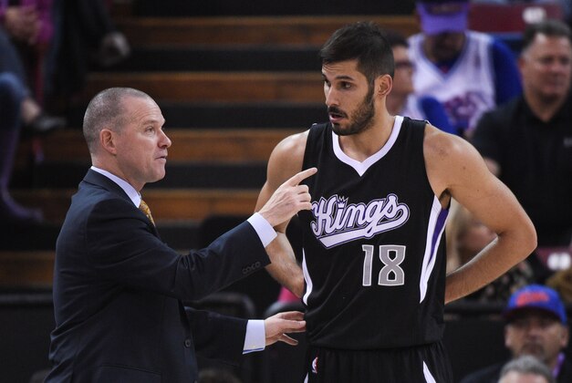 October 31, 2014; Sacramento, CA, USA; Sacramento Kings head coach Michael Malone (left) instructs forward Omri Casspi (18) against the Portland Trail Blazers during the first quarter at Sleep Train Arena. Mandatory Credit: Kyle Terada-USA TODAY Sports