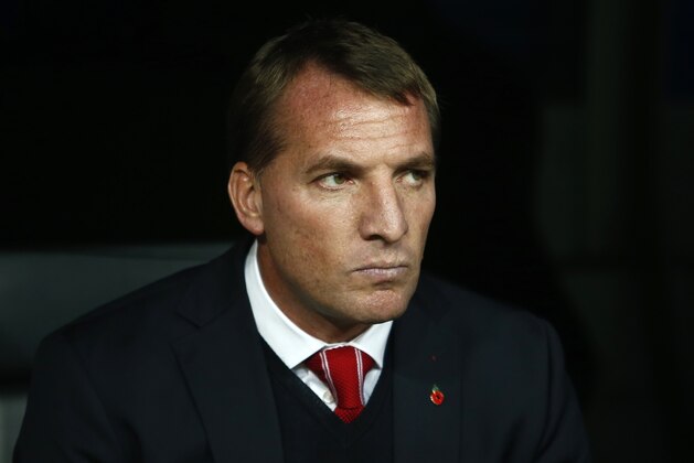 Liverpool's head coach Brendan Rodgers takes his seat before a Group B Champions League soccer match between Real Madrid and Liverpool at the Santiago Bernabeu stadium in Madrid, Spain, Tuesday Nov. 4, 2014. (AP Photo/Andres Kudacki)