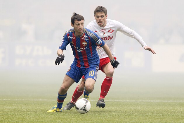 MOSCOW, RUSSIA - APRIL 21: Alan Dzagoev (L) of PFC CSKA Moscow is challenged by Ognjen Vukojevic of FC Spartak Moscow during the Russian Premier League match between PFC CSKA Moscow and FC Spartak Moscow at the Luzhniki Stadium on April 21, 2013 in Moscow, Russia.  (Photo by Dmitry Korotayev/Epsilon/Getty Images)