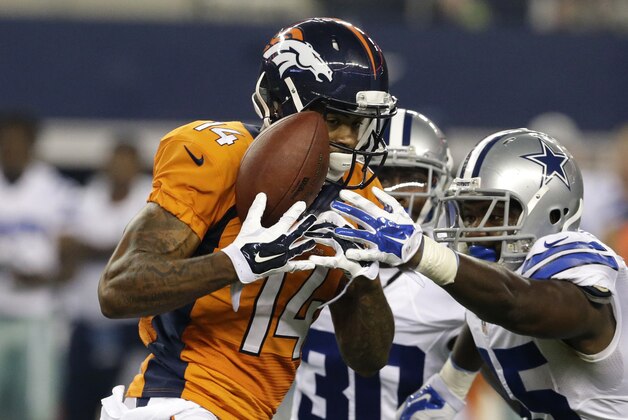 Denver Broncos wide receiver Cody Latimer (14) grabs a pass under pressure from Dallas Cowboys cornerback Terrance Mitchell (30) and cornerback Tyler Patmon, right, in the second half of a NFL preseason football game, Thursday, Aug. 28. 2014, in Arlington, Texas. The reception was good for 57 yards. (AP Photo/LM Otero)