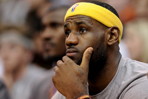 SALT LAKE CITY, UT - NOVEMBER 5: LeBron James #23 of the Cleveland Cavaliers watches first quarter action against the Utah Jazz from the bench at EnergySolutions Arena on November 5, 2014 in Salt Lake City, Utah. NOTE TO USER: User expressly acknowledges and agrees that, by downloading and using this photograph, User is consenting to the terms and conditions of the Getty Images License Agreement. (Photo by Gene Sweeney Jr/Getty Images)