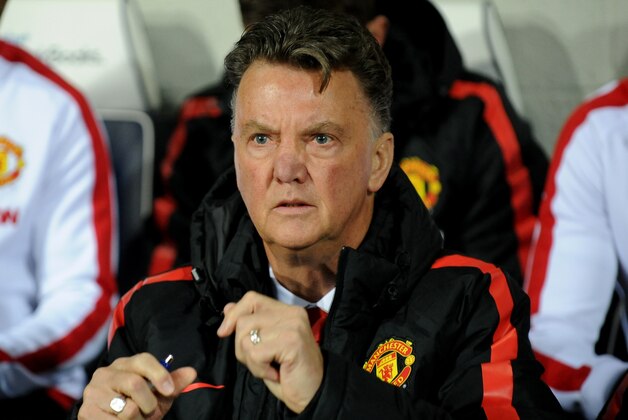 Manchester United manager Louis van Gaal watches in the dug out during the English Premier League soccer match between West Bromwich Albion and Manchester United at the Hawthorns, Birmingham, England, Monday, Oct. 20, 2014. (AP Photo/Rui Vieira)