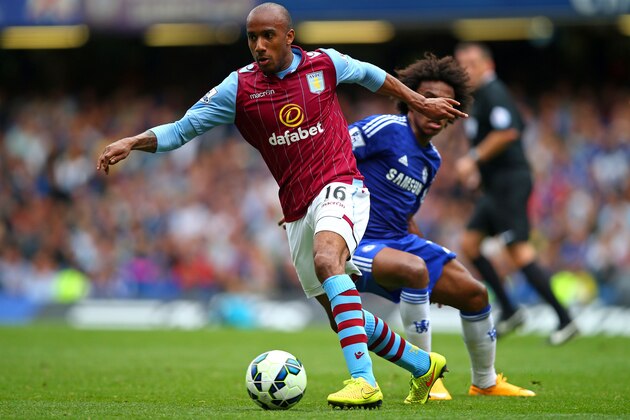 LONDON, ENGLAND - SEPTEMBER 27:  Fabian Delph of Aston Villa goes past the challenge from Willian of Chelsea during the Barclays Premier League match between Chelsea and Aston Villa at Stamford Bridge on September 27, 2014 in London, England.  (Photo by Clive Rose/Getty Images)