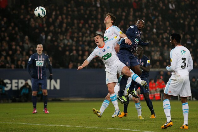 PARIS, FRANCE - FEBRUARY 27:  Zoumana Camara of PSG and Joey Barton and Lucas Mendes  both of Marseille battle for the header during the French Cup match between Paris Saint-Germain FC and Marseille Olympic OM at Parc des Princes on February 27, 2013 in Paris, France.  (Photo by Dean Mouhtaropoulos/Getty Images)