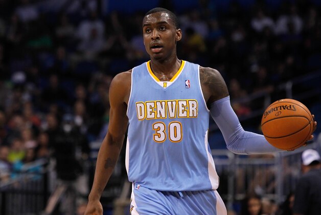 Mar 12, 2014; Orlando, FL, USA; Denver Nuggets forward Quincy Miller (30) drives to the basket against the Orlando Magic during the second quarter at Amway Center. Mandatory Credit: Kim Klement-USA TODAY Sports