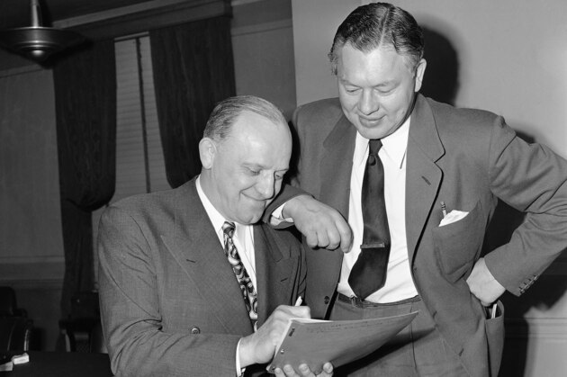 ** ADVANCE FOR WEEKEND EDITIONS, JAN. 22-23 - FILE - ** This Jan. 23, 1947, file photo shows Chicago Bears owner George Halas, left, and Green Bay Packers coach Curley Lambeau , at a meeting in Chicago. Since Lambeau and Halas started the series 90 years ago and made sure there were no friendly handshakes after the game, Packers-Bears has been a ferocious competition between teams, players, coaches and two cold-weather cities about 200 miles apart.  (AP Photo/Ed Maloney/File)