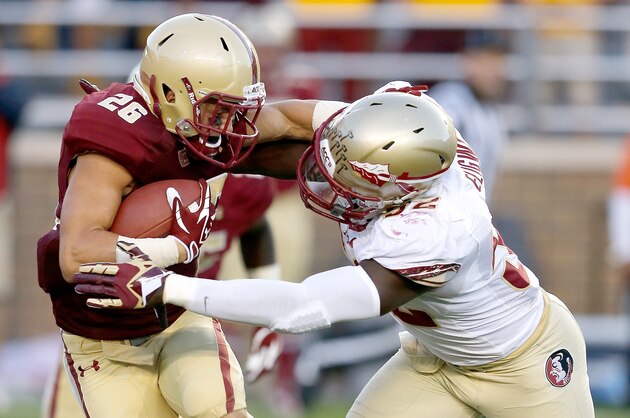 CHESTNUT HILL, MA - SEPTEMBER 28: Ukeme Eligwe #52 of the Florida State Seminoles stops David Dudeck #26 of the Boston College Eagles in the second half at Alumni Stadium on September 28, 2013 in Chestnut Hill, Massachusetts. (Photo by Jim Rogash/Getty Images)