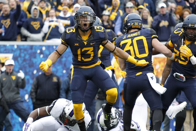 MORGANTOWN, WV - NOVEMBER 01:  Sean Walters #13 of the West Virginia Mountaineers reacts after making a tackle on a kickoff in the first quarter during the game against the TCU Horned Frogs on November 1, 2014 at Mountaineer Field in Morgantown, West Virginia.  (Photo by Justin K. Aller/Getty Images)