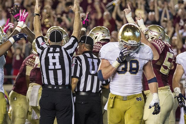 FILE - In this Oct. 18, 2014, file photo, Notre Dame safety Joe Schmidt walks away from a Florida State touchdown in the third quarter of an NCAA college football game in Tallahassee, Fla. Schmidt fractured and dislocated his left ankle last week in a 49-35 victory over Navy. Schmidt’s injury forces freshman Nyles Morgan into a likely starting role Saturday, Nov. 8, 2014,  when the eighth-ranked Fighting Irish play at No. 11 Arizona State. (AP Photo/Mark Wallheiser, File)