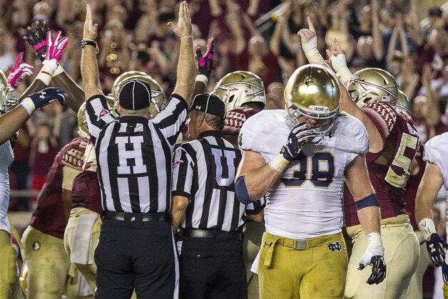 FILE - In this Oct. 18, 2014, file photo, Notre Dame safety Joe Schmidt walks away from a Florida State touchdown in the third quarter of an NCAA college football game in Tallahassee, Fla. Schmidt fractured and dislocated his left ankle last week in a 49-35 victory over Navy. Schmidt’s injury forces freshman Nyles Morgan into a likely starting role Saturday, Nov. 8, 2014,  when the eighth-ranked Fighting Irish play at No. 11 Arizona State. (AP Photo/Mark Wallheiser, File)