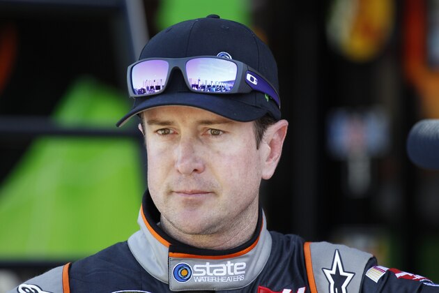 Kurt Busch looks from the garage after practice for Saturday's NASCAR Bank of America Sprint Cup series auto race at Charlotte Motor Speedway in Concord, N.C., Thursday, Oct. 9, 2014. (AP Photo/Terry Renna)