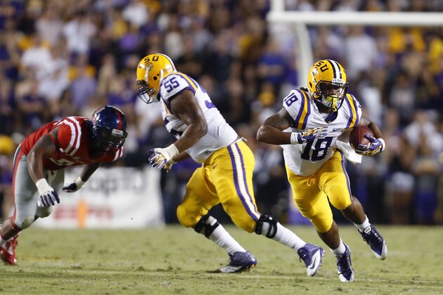 LSU running back Terrence Magee (18) carries in the first half of an NCAA college football game against Mississippi in Baton Rouge, La., Saturday, Oct. 25, 2014. (AP Photo/Jonathan Bachman)