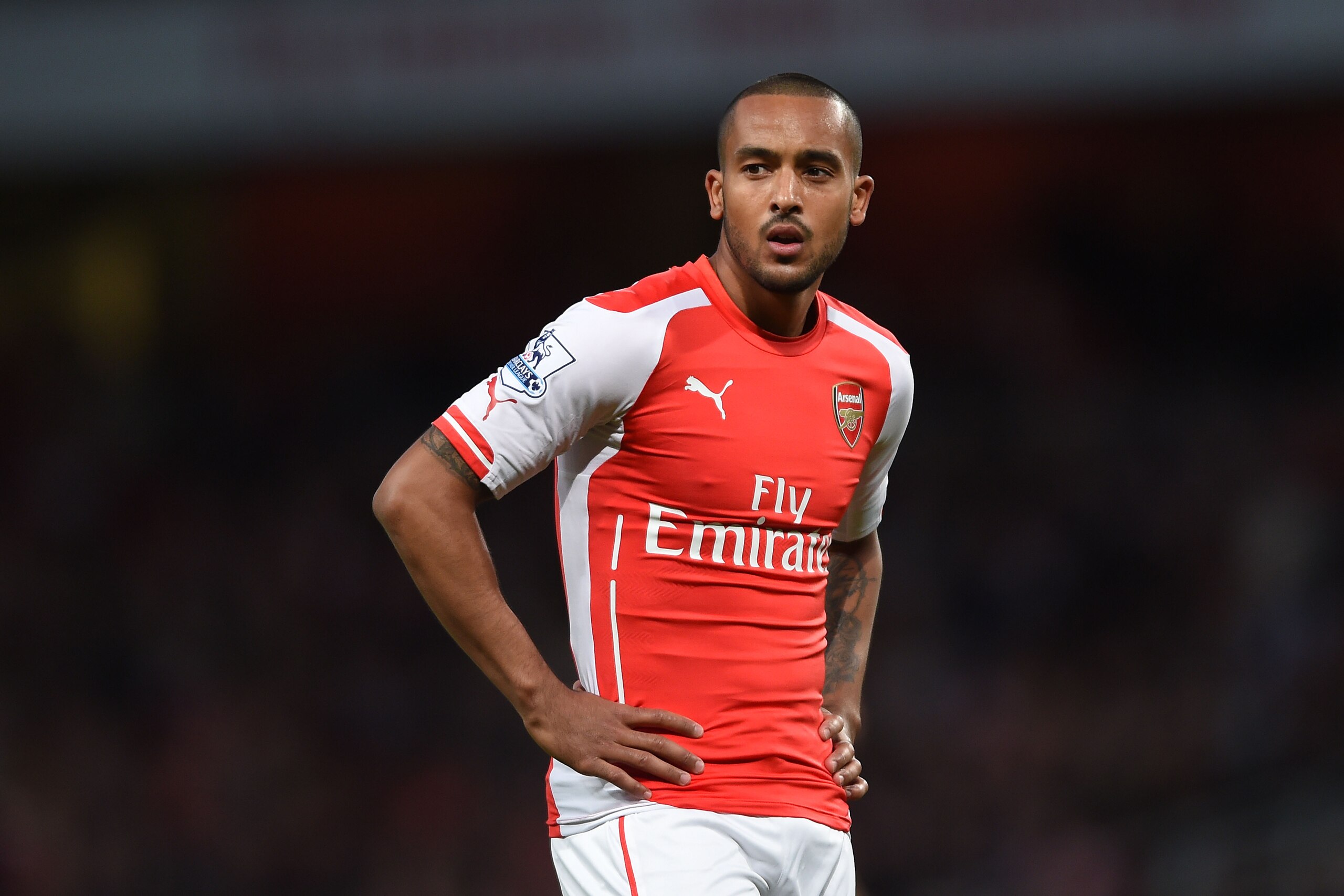 Arsenal’s Theo Walcott looks across the pitch during their English Premier League soccer match against Burnley at the Emirates stadium, London, Saturday, Nov. 1, 2014. (AP Photo/Tim Ireland)