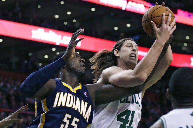 Boston Celtics center Kelly Olynyk (41) battles for a rebound with Indiana Pacers center Roy Hibbert (55) during the first quarter of an NBA basketball game, Friday, Nov. 22, 2013, in Boston. (AP Photo/Charles Krupa)