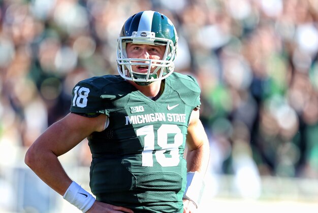 Oct 25, 2014; East Lansing, MI, USA; Michigan State Spartans quarterback Connor Cook (18) looks on during the first quarter of a game at Spartan Stadium. Mandatory Credit: Mike Carter-USA TODAY Sports