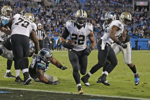 New Orleans Saints' Mark Ingram (22) runs into the end zone for a touchdown against the Carolina Panthers in the second half of an NFL football game in Charlotte, N.C., Thursday, Oct. 30, 2014. (AP Photo/Bob Leverone)