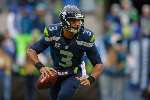SEATTLE, WA - NOVEMBER 02:  Quarterback Russell Wilson #3 of the Seattle Seahawks rolls out to pass against the Oakland Raiders at CenturyLink Field on November 2, 2014 in Seattle, Washington.  (Photo by Otto Greule Jr/Getty Images)