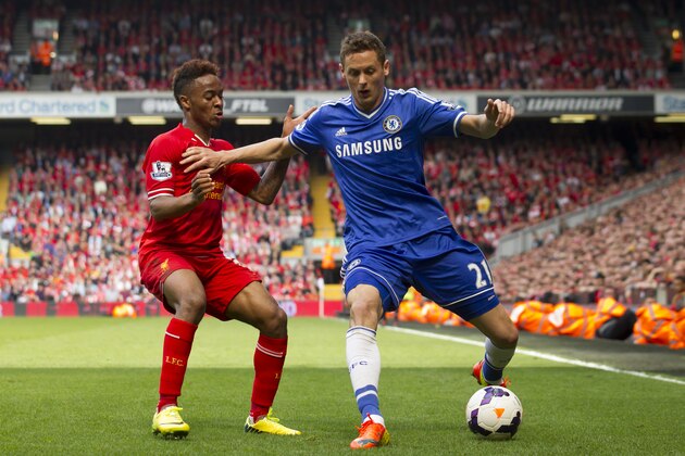 Chelsea's Nemanja Matic, right, keeps the ball from Liverpool's Raheem Sterling during their English Premier League soccer match at Anfield Stadium, Liverpool, England, Sunday April 27, 2014. (AP Photo/Jon Super)