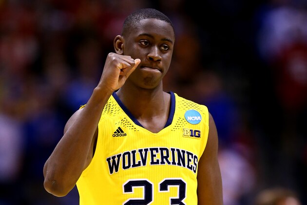 INDIANAPOLIS, IN - MARCH 28:  Caris LeVert #23 of the Michigan Wolverines celebrates defeating the Tennessee Volunteers 73 to 71 during the regional semifinal of the 2014 NCAA Men's Basketball Tournament at Lucas Oil Stadium on March 28, 2014 in Indianapolis, Indiana.  (Photo by Andy Lyons/Getty Images)