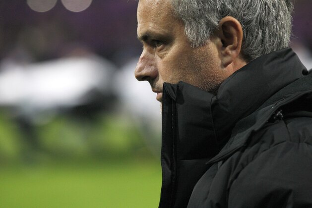 Chelsea's head coach Jose Mourinho, right, watches a game during the Champions League group G soccer match between Chelsea FC and Maribor, in Maribor, Slovenia, Wednesday, Nov. 5, 2014.(AP Photo/Nikola Solic)