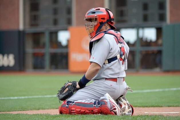 SAN FRANCISCO, CA - OCTOBER 14:  Yadier Molina #4 of the St. Louis Cardinals warms up in the bullpen in the eighth inning while taking on the San Francisco Giants during Game Three of the National League Championship Series at AT&T Park on October 14, 2014 in San Francisco, California.  (Photo by Harry How/Getty Images)