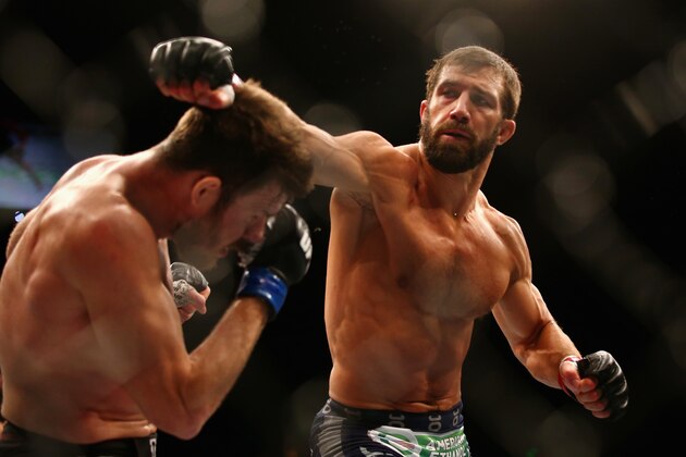 SYDNEY, AUSTRALIA - NOVEMBER 08:  Michael Bisping of England ducks a punch from Luke Rockhold of the USA in their middleweight fight during the UFC Fight Night 55 event at Allphones Arena on November 8, 2014 in Sydney, Australia.  (Photo by Mark Kolbe/Getty Images)