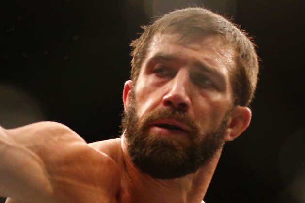 SYDNEY, AUSTRALIA - NOVEMBER 08:  Michael Bisping of England ducks a punch from Luke Rockhold of the USA in their middleweight fight during the UFC Fight Night 55 event at Allphones Arena on November 8, 2014 in Sydney, Australia.  (Photo by Mark Kolbe/Getty Images)