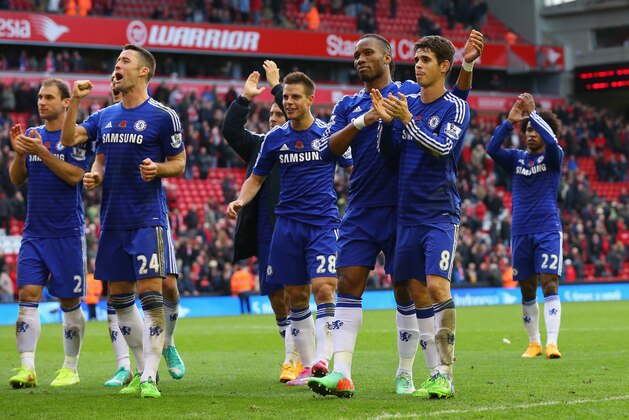 LIVERPOOL, ENGLAND - NOVEMBER 08:  Gary Cahill, Didier Drogba and Oscar of Chelsea celebrate victory after the Barclays Premier League match between Liverpool and Chelsea at Anfield on November 8, 2014 in Liverpool, England.  (Photo by Alex Livesey/Getty Images)