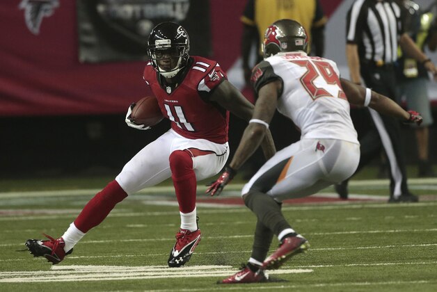 Atlanta Falcons wide receiver Julio Jones (11) moves against Tampa Bay Buccaneers cornerback Leonard Johnson (29) during the first half of an NFL football game, Thursday, Sept. 18, 2014, in Atlanta. (AP Photo/John Bazemore)