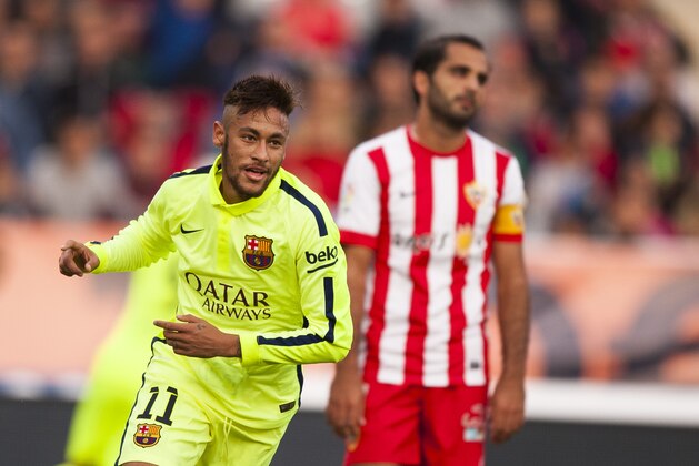 FC Barcelona's Neymar da Silva from Brazil, left, celebrates after scoring a goal against Almeria during a Spanish La Liga soccer match in Almeria, Spain, Saturday, Nov. 8, 2014. (AP Photo/Daniel Tejedor)