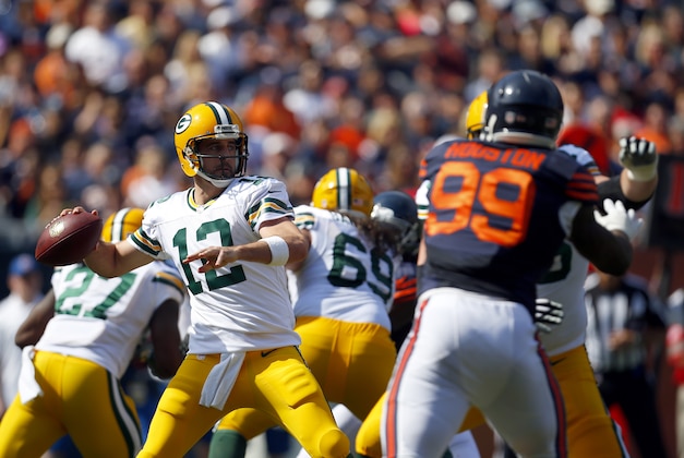 Green Bay Packers quarterback Aaron Rodgers (12) looks to pass against the Chicago Bears during an NFL game at Soldier Field in Chicago on Sunday, Sept. 28, 2014. (Jeff Haynes/AP Images for Panini)