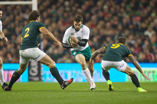 DUBLIN, IRELAND - NOVEMBER 08:   Jared Payne of Ireland is tackled by Bismarck Du Plessis and Francois Houggard of South Africa during the 2014 Guinness series International match between Ireland and South Africa at Aviva Stadium on November 8, 2014 in Dublin, Ireland.  (Photo by Patrick Bolger/Getty Images)