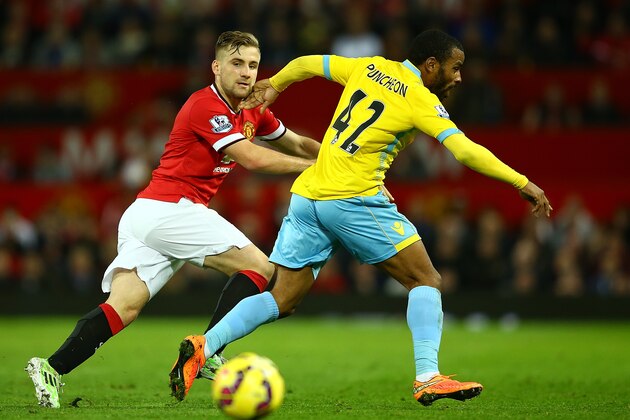 MANCHESTER, ENGLAND - NOVEMBER 08:  Luke Shaw of Manchester United competes with Jason Puncheon of Crystal Palace during the Barclays Premier League match between Manchester United and Crystal Palace at Old Trafford on November 8, 2014 in Manchester, England.  (Photo by Richard Heathcote/Getty Images)