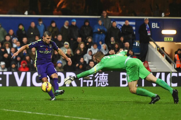LONDON, ENGLAND - NOVEMBER 08:  Sergio Aguero of Manchester City beats goalkeeper Robert Green of QPR to score their second goal during the Barclays Premier League match between Queens Park Rangers and Manchester City at Loftus Road on November 8, 2014 in London, England.  (Photo by Tom Dulat/Getty Images)