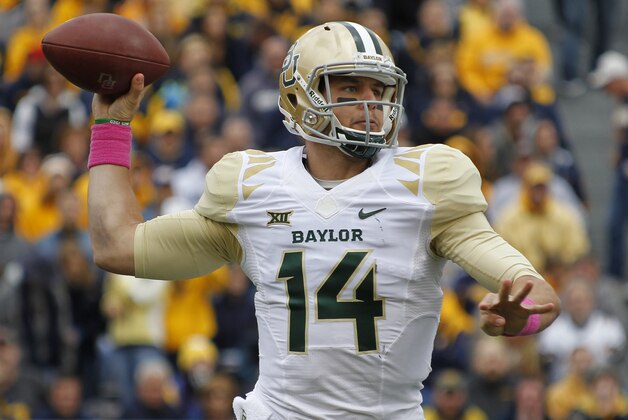 MORGANTOWN, WV - OCTOBER 18:  Bryce Petty #14 of the Baylor Bears drops back to pass during the game against the West Virginia Mountaineers on October 18, 2014 at Mountaineer Field in Morgantown, West Virginia.  (Photo by Justin K. Aller/Getty Images)