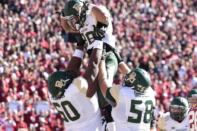 NORMAN, OK - NOVEMBER 8:  Guard LaQuan McGowan #60, offensive tackle Spencer Drango #58 and running back Devin Chafin #28 of the Baylor Bears celebrate a touchdown against the Oklahoma Sooners November 8, 2014 at Gaylord Family-Oklahoma Memorial Stadium in Norman, Oklahoma.  (Photo by Brett Deering/Getty Images)