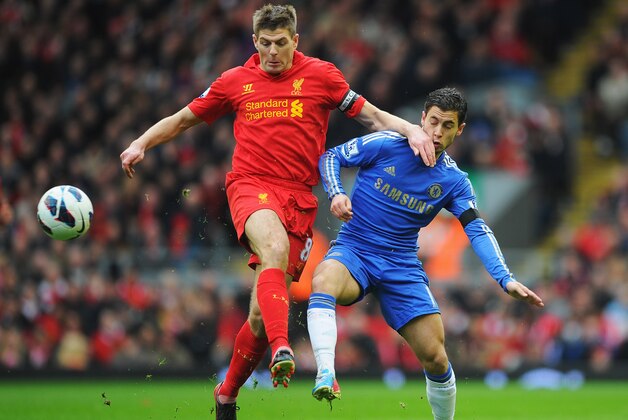 LIVERPOOL, ENGLAND - APRIL 21:  Steven Gerrard of Liverpool challenges Eden Hazard of Chelsea during the Barclays Premier League match between Liverpool and Chelsea at Anfield on April 21, 2013 in Liverpool, England.  (Photo by Michael Regan/Getty Images)