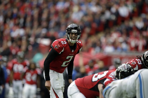 Atlanta Falcons quarterback Matt Ryan (2) calls a play in the first half of the NFL football game against the Detroit Lions at Wembley Stadium, London, Sunday, Oct. 26, 2014.  (AP Photo/Matt Dunham)