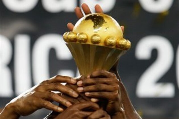 Nigeria players celebrate with the trophy after defeating Burkina Faso in the final to win the African Cup of Nations at the Soccer City Stadium in Johannesburg, South Africa, Sunday, Feb. 10, 2013. (AP Photo/Armando Franca)