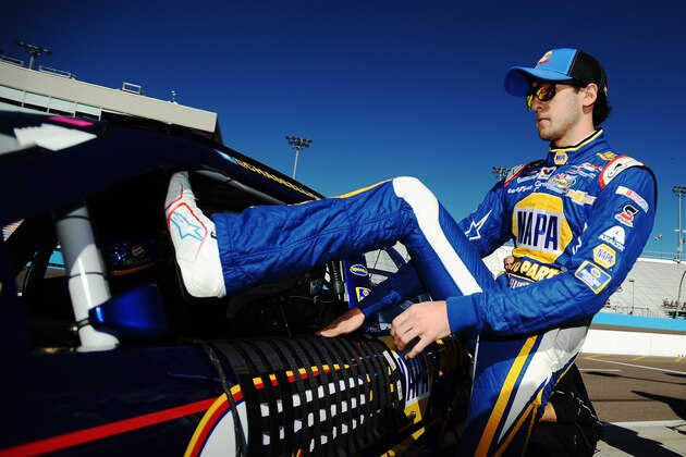AVONDALE, AZ - NOVEMBER 08: Chase Elliott, driver of the #9 NAPA Auto Parts Chevrolet, climbs into his car during qualifying for the NASCAR Nationwide Series DAV 200 at Phoenix International Raceway on November 8, 2014 in Avondale, Arizona.  (Photo by Rainier Ehrhardt/Getty Images)