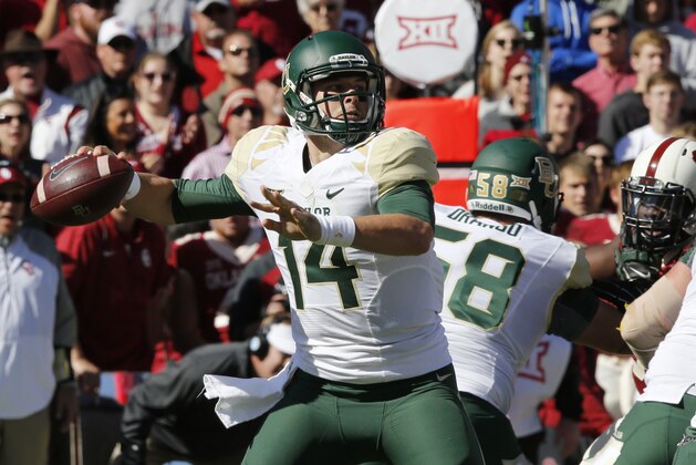 Baylor quarterback Bryce Petty (14) passes in the second quarter of an NCAA college football game against Oklahoma in Norman, Okla., Saturday, Nov. 8, 2014. (AP Photo/Sue Ogrocki)