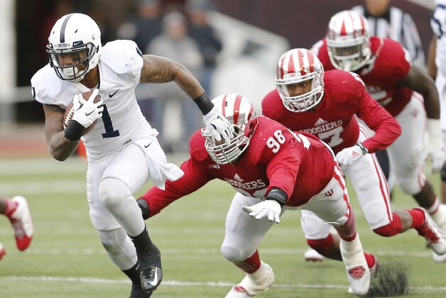 Penn State running back Bill Belton (1) gets past Indiana defensive tackle Darius Latham (98) during the second half of an NCAA college football game in Bloomington, Ind., Saturday, Nov. 8, 2014. Penn State won the game 13-7. (AP Photo/Sam Riche)