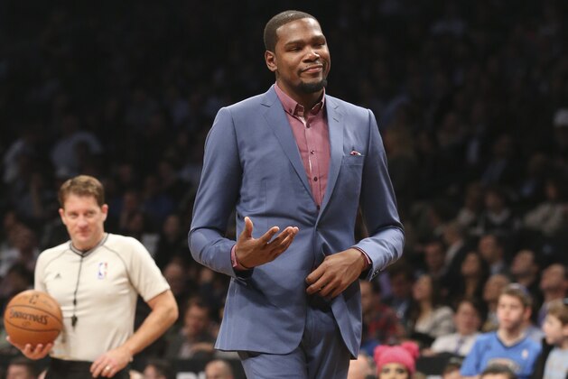 Oklahoma City Thunder forward Kevin Durant reacts after arguing with a referee during a time-out in the second half of an NBA basketball game against the Brooklyn Nets, Monday, Nov. 3, 2014, in New York. The Nets won 116-85. (AP Photo/John Minchillo)