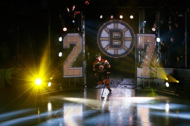 BOSTON, MA - OCTOBER 8:  Dougie Hamilton #27 of the Boston Bruins makes his way onto the ice before a game with the Philadelphia Flyers  in their NHL season opener on October 8, 2014 in Boston, Massachusetts.  (Photo by Jim Rogash/Getty Images)