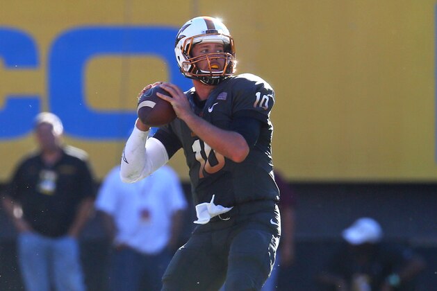 Nov 8, 2014; Tempe, AZ, USA; Arizona State Sun Devils quarterback Taylor Kelly drops back to pass in the second quarter against the Notre Dame Fighting Irish at Sun Devil Stadium. Mandatory Credit: Mark J. Rebilas-USA TODAY Sports