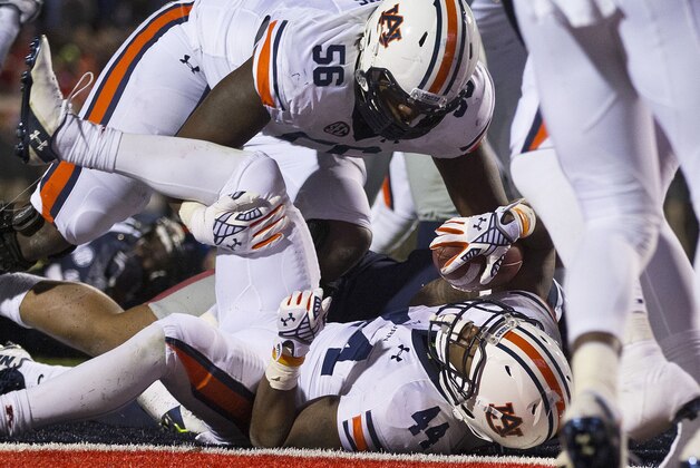 Auburn running back Cameron Artis-Payne (44) scores the final Auburn touchdown during the second half of an NCAA college football game against Mississippi, Saturday, Nov. 1, 2014, in Oxford, Miss. Auburn won 35-31. (AP Photo/Brynn Anderson)