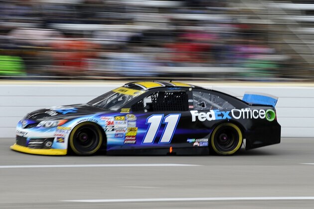 Denny Hamlin (11) drives during the NASCAR Sprint Cup Series auto race at Texas Motor Speedway in Fort Worth, Texas, Sunday, Nov. 2, 2014. (AP Photo/Ralph Lauer)