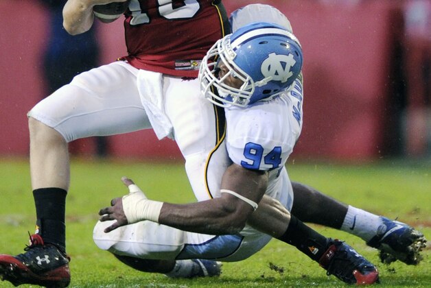 Maryland quarterback Chris Turner (10) is sacked by North Carolina defender Michael McAdoo (94)during the first half of an NCAA college football game, Saturday, Nov. 15, 2008, in College Park, Md.(AP Photo/Nick Wass)